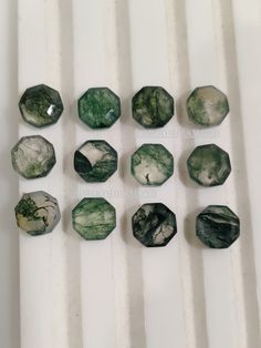 green and white marbles are arranged in rows