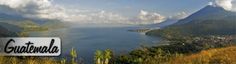 a scenic view of the mountains, water and clouds with an advertisement for guatemala written on it