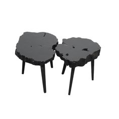 two tables made out of wood with black legs and one is shaped like a flower