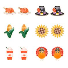 a set of pins with different designs and colors on them, including pumpkins, cornucts, hats, and hotdogs