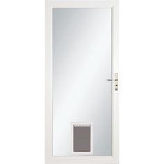 a white door with a mirror on the side and a dog door in the middle