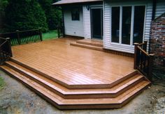 a wooden deck with steps leading up to it