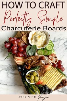 a cheese board with grapes, cucumbers, and crackers on it is featured in the article how to craft perfectly simple charcuterie boards