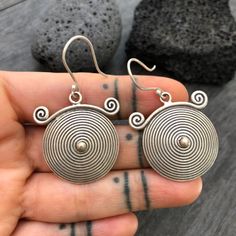 You can choose from 3 unique sterling silver earrings, made with round spiral shapes. 3 Different but unique spiral round silver earrings, perfect for your day by day outfits, easy to match any other accessories. Statement earring that are also light and easy to wear. You can see in one of the pictures there is a number that represents each pair. Pair 1- 2.5cm- 1 inch long 1.8cm- 0.75 inch wide It has a drop length of 4.3cm- 1.75 inch Pair 2- 3cm- 1.25 inch long 2cm- 0.90 inch wide It has a drop Spiral Single Earring As Gift, Spiral Single Earring Gift, Unique Spiral Earrings For Gift, Spiral Sterling Silver Earrings For Gift, Spiral Sterling Silver Earrings As Gift, Unique Spiral Sterling Silver Jewelry, Silver Spiral Wrap Earrings, Pierced, Handmade Sterling Silver Round Plug Earrings, Spiral Pierced Earrings As Gift