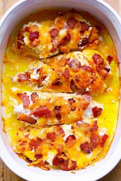 a casserole dish with chicken, cheese and bacon in it on a white plate