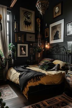 a bedroom with black walls and pictures on the wall above the bed, along with an area rug