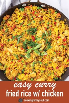 an easy curry fried rice with chicken in a skillet