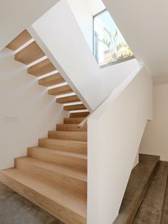 there is a wooden stair case in the house