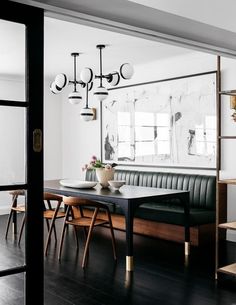 an image of a dining room with black and white decor