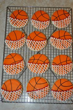 decorated cookies with basketballs on a cooling rack