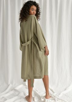 Spoil yourself with a linen bathrobe that's incredibly soft, light, and breathable. Handcrafted of premium quality European linen, this moss green kimono-style bathrobe feels so good to the skin, you'll never want to take it off. The linen robe features a relaxed fit, long sleeves, an adjustable waistband, and comfy outer pockets, making it the ultimate addition to your at-home wear. The model is 175 cm (69'') tall and is wearing a bathrobe in size S/M. DETAILS - Handmade from high-quality Europ Summer Linen Robe With Long Sleeves, Spring Linen Loungewear Robe, Relaxed Linen Summer Robe, Summer Linen Robe With Relaxed Fit, Summer Long Linen Robe, Long Linen Summer Robe, Relaxed Fit Linen Summer Robe, Summer Linen Robe With Kimono Sleeves, Relaxed Fit Linen Robe For Spring