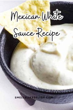 mexican white sauce recipe in a black bowl with tortilla chips on the side