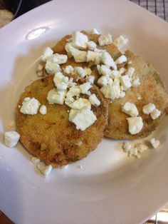 two food items on a white plate with silverware