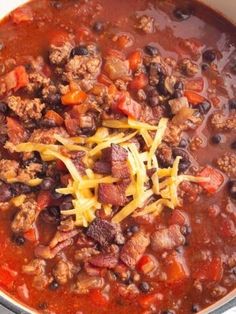 a large pot filled with chili and cheese