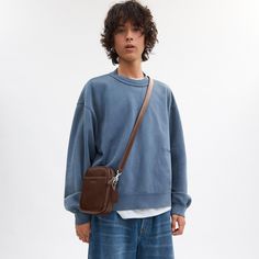 Combining effortless style and major functionality our Hitch takes you to work weekends and everywhere in between. Inspired by vintage camera bags this compact streamlined crossbody has an interior multifunction pocket to hold small accessories and an exterior slip pocket for easy access to essentials. Crafted of natural grain leather with beautiful texture and a soft feel it’s finished with a zip-top closure and a detachable strap for crossbody wear. | Coach Hitch Crossbody Designer Crossbody - Small Handbag For Men, Hudson Crossbody Coach, Crossbody Coach, Camera Bags, Designer Crossbody, Messenger Bag Men, Vintage Camera, Beautiful Textures, Feel It