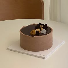 there is a chocolate cake with bananas on the top and some other toppings in the middle