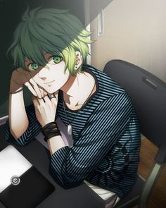 a man with green hair sitting at a desk in front of a laptop computer and holding his hand to his face