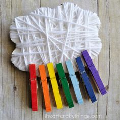 a bunch of colorful crayons sitting on top of a wooden table