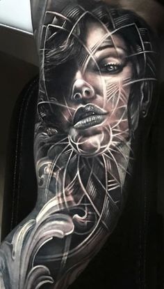 a woman's arm with tattoos on it and an image of her face in the middle