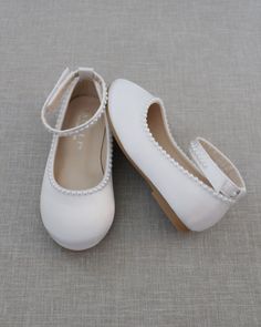 "Classic satin flats with velcro ankle strap with added mini pearls for more adorable look. It makes the perfect simplicity for any occasion. For flower girls, pair up with tutu ballerinas, fairies or birthday parties. DETAILS: COLORS AVAILABLE: White and Ivory UPPER: Synthetic upper and lining MATERIALS: Mandmade STYLE NAME: HARPER-57 Not sure of which size to purchase? Shoes measurements are as follow: (Please note measurements taken the length of inside of shoe from toe to heel) Baby (Soft so Girl Necessities, Girls Wedding Shoes, Christening Shoes, Flower Girl Shoes, Pointy Toe Flats, Bridesmaid Shoes, Wedding Vibes, Womens Wedding Shoes, Angel Eyes