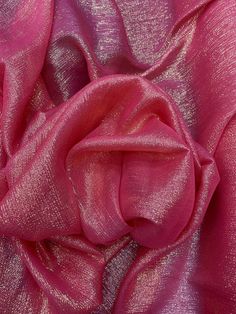 the fabric is shiny and bright pink