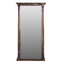 a large mirror sitting on top of a wooden frame