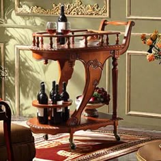 a wooden serving cart with wine bottles and glasses on it in a living room setting