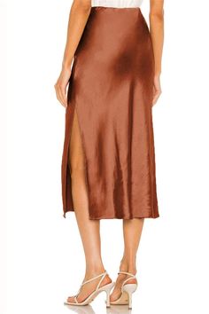 Elevate your style with the High Waist Satin Patchwork Midi Skirt. Featuring a slim fit, elegant patchwork design, and a flattering split detail, this skirt embodies sophistication and modern fashion, perfect for various stylish occasions. Details: Material: POLYESTER Elasticity: Non Stretch Fabric Type: blended Waistline: Natural Silhouette: A-LINE Size (IN) Waist Hip Skirt length S 26.38 36.22 29.92 M 27.95 37.80 30.31 L 30.31 40.16 30.91 XL 32.68 42.52 31.50