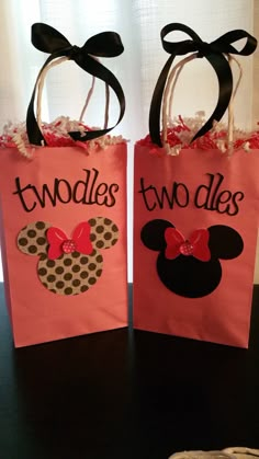 two pink bags with minnie mouses on them