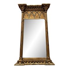 an ornate gold framed mirror against a white background