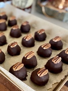 there are chocolates with peanut butter in the middle on a baking sheet, ready to go into the oven