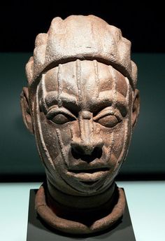 an ancient head on display in a museum