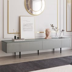 a console table with two vases and a mirror on the wall above it in a white room