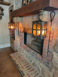 a brick fireplace with an old fashioned light on it's mantle and lanterns hanging from the ceiling