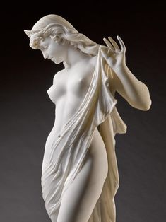 a statue of a woman with her hands in her hair