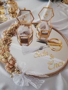 a table topped with gold and white decorations