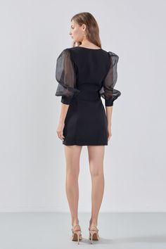 This Organza Blouson Mini Dress is the perfect addition to your wardrobe! Beautifully crafted from a mix of organza and other materials it features a boat neckline fitted bodice and mini length. Show off your legs and make a statement in this head-turning dress. It is sure to leave a lasting impression with its unique design and its exquisite materials will ensure you look stunning all night long. Make it yours today! Mixed media Mini length Boat neckline Fitted bodice Organza blouson sleeves Cu Black Mini Dress With Sheer Bodice, Fitted Organza Mini Dress For Evening, Elegant Black Mini Dress With Sheer Bodice, Formal Fitted Mini Dress With Sheer Bodice, Black Organza Mini Dress, Black Mini Dress With Sheer Bodice For Cocktail, Chic Sheer Organza Mini Dress, Sheer Mini Length Formal Dresses, Formal Sheer Mini Length Dress