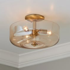 a light fixture in a room with white walls