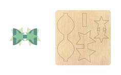 a wooden cutting board with some cut outs on it and an image of three stars