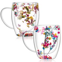 three glass mugs with colorful flowers on them