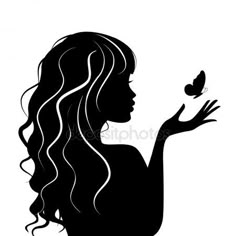 silhouette of a woman holding a butterfly in one hand and the other hand out to her side