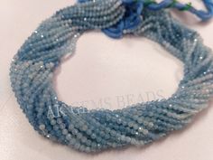 a blue beaded bracelet with flowers on it