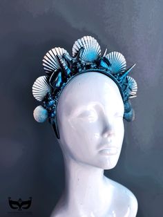 Yet another attempt at capturing the beauty of the ocean with our mermaid crown, crafted from an exquisite selection of seashells and inspired by the wonder of the sea. Handcrafted in deep ocean blues and shimmering black highlights, this seashell headband is for any sea-loving mermaid looking to add a touch of mystical magic to their look. 



Color - Deep Blue hues and black shimmer highlights


Age Group/Gender - 
Fits ages 10 and up & Adults Unisex

Material - Headband with sea shells and pa Material Headband, Seashell Headband, Mermaid Headpiece, Seashell Crown, Fantasy Crown, Ocean Mermaid, Mermaid Stuff, Mermaid Crown, Black Highlights