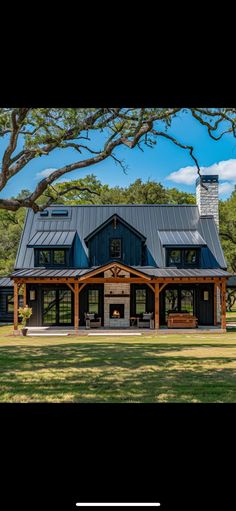 this is an image of a large house in the middle of a field with trees and grass