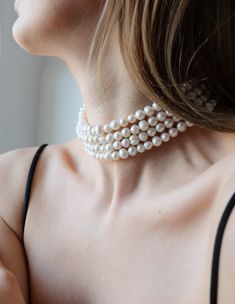 Add a touch of elegance and sophistication to your look with our stunning four-row pearl choker. Made with high-quality materials and expert craftsmanship, this choker necklace is a true statement piece that's sure to turn heads. Featuring fpur rows of lustrous pearls, this choker is designed to sit comfortably on your neck, making it the perfect accessory for special occasions or everyday wear. The pearls are carefully selected for their consistent size, shape, and luster, ensuring that each necklace is of the highest quality. The choker itself is made from durable materials, ensuring that it will last for years to come. The clasp is easy to use and secure, ensuring that the necklace stays in place throughout the day or night. Whether you're dressing up for a formal event or adding a touc Layered Pearl Choker, Jewellery Photography, Bracelets Easy, Real Pearl Necklace, Chunky Pearls, Wedding Necklaces, Pearl Chain Necklace, Floating Necklace, Layered Chokers