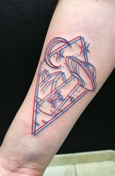 a tattoo on the arm of a person with red and blue lines coming out of it