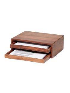 two wooden boxes with papers in them sitting on top of each other, one open and the other closed