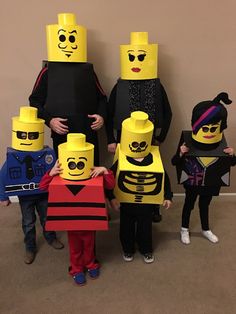 several children in lego costumes standing next to each other