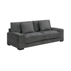 a gray couch sitting on top of a white floor