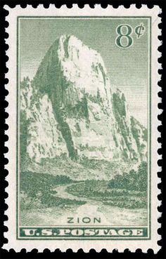 an old postage stamp with a mountain in the background